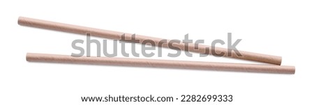 Beige paper cocktail straws on white background