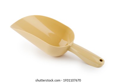Beige plastic scoop on white insulated background.
