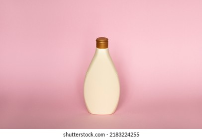 Beige Plastic Soap Or Shampoo Bottle Isolated On Pink Background. Skin Care Lotion. Bathing Essential Product. Shampoo Bottle. Bath And Body Lotion. Fine Liquid Hand Wash. Bathroom Accessories.