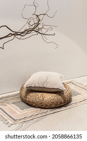 Beige Printed Cushion On Rattan Stool Interior Design