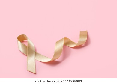 Beige ribbon on pink background. Uterine cancer awareness concept - Powered by Shutterstock