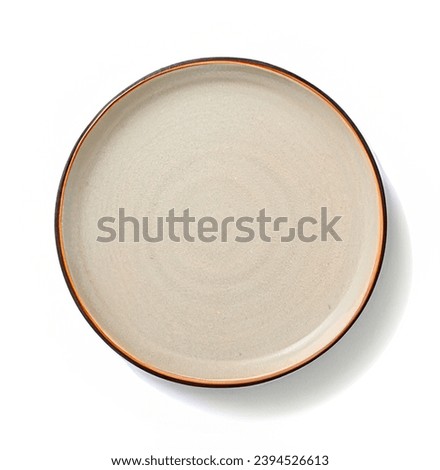 Beige Round stoneware plate, empty. Top view, isolated on white background with clipping path