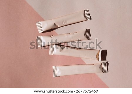 Beige sachets with empty space for text. Product packaging mockup for advertisement. Minimalist design for beauty or food industry concept.