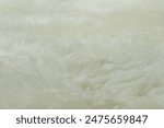 beige sheepskin texture with soft hairs, natural fur for designer, the concept of processing, production of furrier products, stress relief, psychological stress