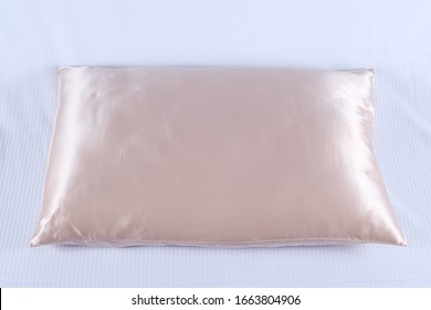
Beige Silk Pillowcase On A Pillow Close-up

