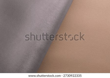 beige and silver artificial leather with waves and folds on PVC base