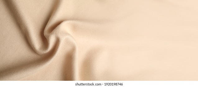 Beige soft cashmere fabric as background, closeup view with space for text. Banner design
