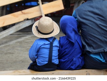 The Beige Straw Hat On A Young Amish Boy