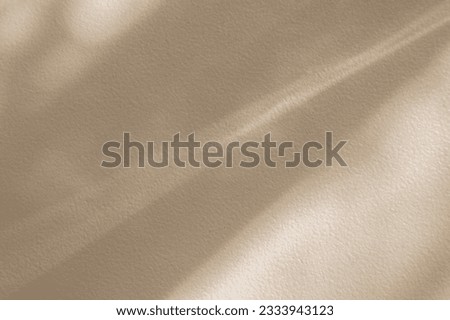Beige texture background with gradient diagonal slanted lines with the effect of scattered light rays in the form of shadows on the wall. Abstract modern creative graphic template for presentation.