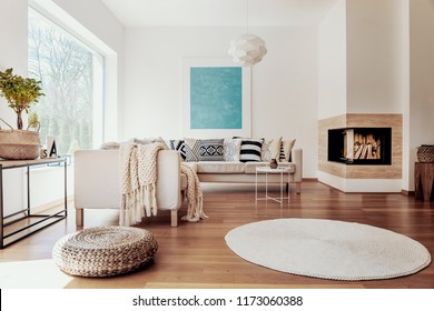 Beige And White Textiles And A Modern Spherical Pendant Light In A Sunny, Tranquil Living Room Interior With Natural Decor.