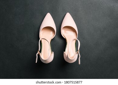 Beige Women Shoes Isolated On A Black Background. Women's Fashion And Style. Flat Layout, Top View