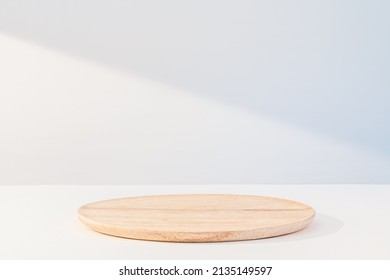 Beige wooden dish on white. Food or product podium - Shutterstock ID 2135149597