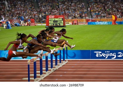BEIJING - AUGUST 18: Athletes clear the hurdles during the women's 110M hurdles race at the Beijing Summer Olympics. August 18, 2008 Beijing, China