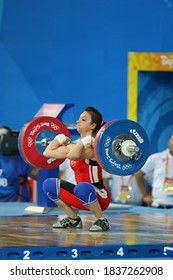 BEIJING - AUGUST 9: 2008 Beijing Olympics in the women's 48 kilos in weight and winning silver medal in weightlifting competitions Sibel Ozkan of Turkey while lifting dumbbells.