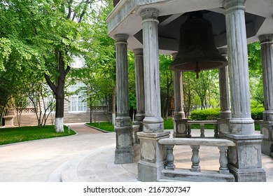 Beijing, China - 05.11.2019 : Stone Gazebo With An Old Bell In The Center Of The City Square.