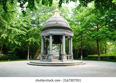 Beijing, China - 05.11.2019 : Stone Gazebo With An Old Bell In The Center Of The City Square.