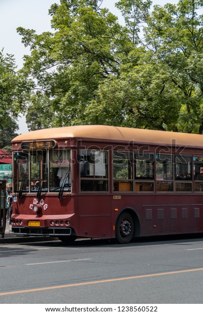 Beijing, China - 06/07/2018 : Old bus in a street\
of Beijing