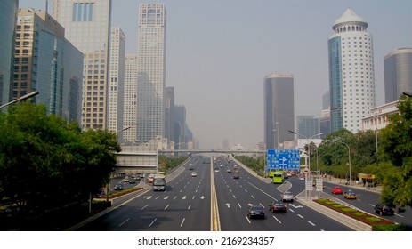 Beijing, China - 08 30 2009: Sunday Morning View Of The Jianguo Road Next To The East 3rd Ring Road With The China World Trade Center Building On The Right Side And The SOHO On The Left Side