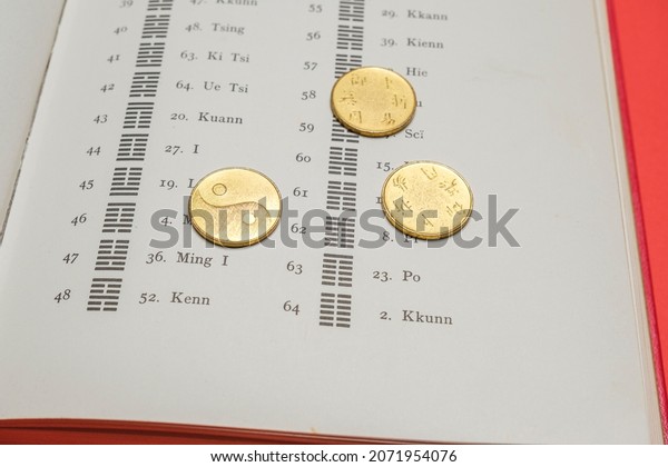 Beijing, China, 08-11-21: I ching ancient Chinese
oracle, Book of Changes or Classic of Changes. The book is opened
on the pages of hexagrams. The Hexagrams are symbols used to
represent the dynamics
