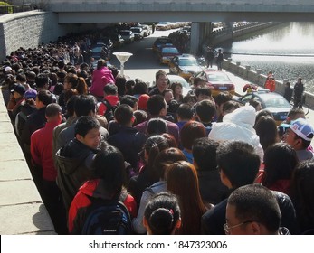 Beijing, China - April 3, 2012 : People Are Lining Up For Buses On Golden Week.