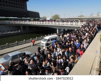 Beijing, China - April 3, 2012 : People Are Lining Up For Buses On Golden Week.