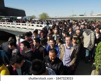 Beijing, China - April 3, 2012 : People Are Lining Up For Buses On Golden Week.