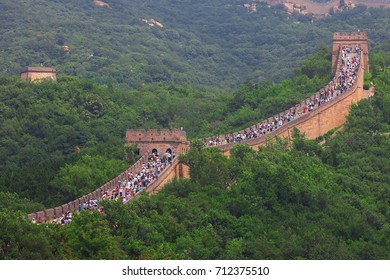 Beijing, China - August 10, 2017: Crowd Tourists Climb Badaling Great Wall Near Beijing. The Ming Dynasty Walls Measure 8,850 Km In Length, From China's East Coast Till The Gobi Desert In The West.