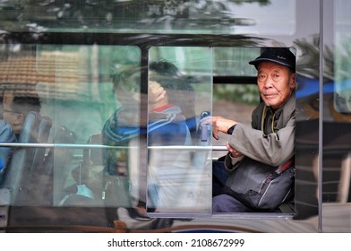 BEIJING, CHINA - Dec 12, 2021: An Elderly Man On A Bus In Beijing, China