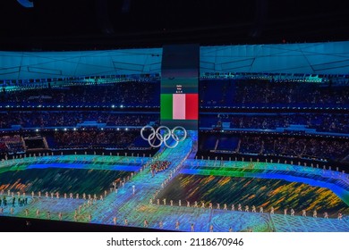 BEIJING, CHINA - FEBRUARY 04: Flag bearer Michela Moioli of Team Italy carries their flag during the Opening Ceremony of the Beijing 2022 Winter Olympics at the Beijing National Stadium