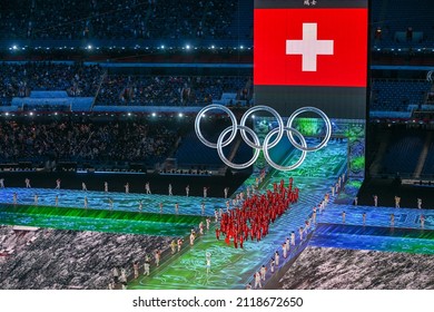 BEIJING, CHINA - FEBRUARY 04: Flag bearers Andres Ambuhl and Wendy Holdener of Team Switzerland carry their flag during the Opening Ceremony of the Beijing 2022 Winter Olympics