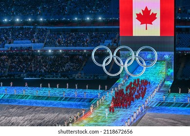 BEIJING, CHINA - FEBRUARY 04: Flag bearers Charles Hamelin and Marie-Philip Poulin of Team Canada carry their flag during the Opening Ceremony of the Beijing 2022 Winter Olympics