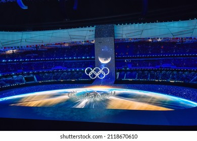 BEIJING, CHINA - FEBRUARY 04: A view of the stadium as the large snowflake and a large Olympic ring logo is seen while performer’s dance during the Opening Ceremony of the Beijing 2022 Winter Olympics