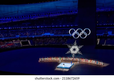 BEIJING, CHINA - FEBRUARY 04: A  View Inside The Stadium As The Large Snowflake And Olympic Ring Logo Is Seen While Performer’s Dance During The Opening Ceremony Of The Beijing 2022 Winter Olympics