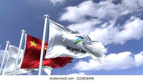 Beijing, China, February 2022: The flag of Beijing 2022 Paralympics waving in the wind with the national flag of China. Winter paralympics games are scheduled to take place from 4 to 13 march 2022