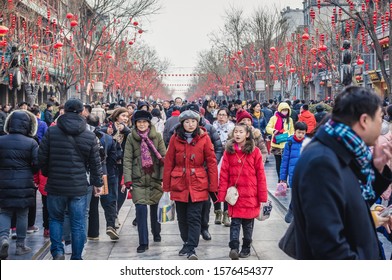 Beijing, China - February 6, 2019: Crowd Of People On Famous Pedestrian Qianmen Street In Beijing Capital City