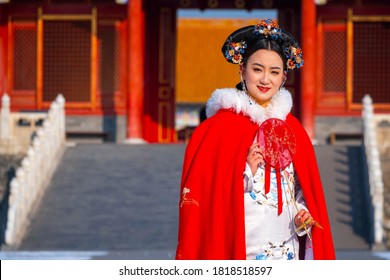 Beijing, China - Jan 9 2020: Unidentified Chinese woman in Chinese traditional dress at the Forbidden City - Shutterstock ID 1818518597