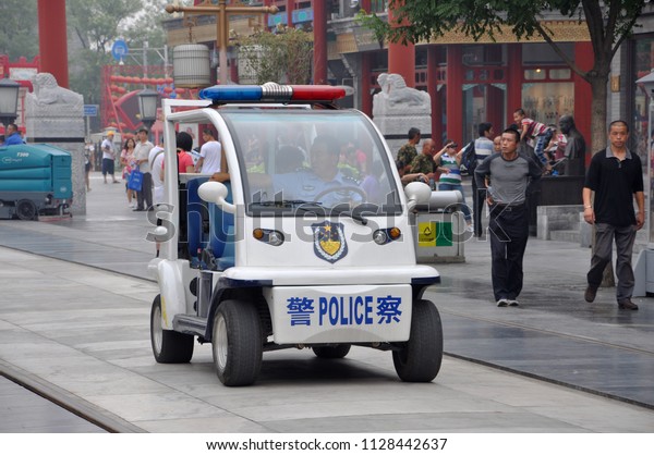 BEIJING, CHINA - JUN.24, 2012: Electric\
Police Car patrol in the street in Beijing,\
China.