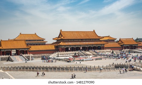 Beijing, China – June 5 2018: Traditional Buildings Of The Famous Forbidden Palace City With A Tourist People Walking Around In Beijing, China.