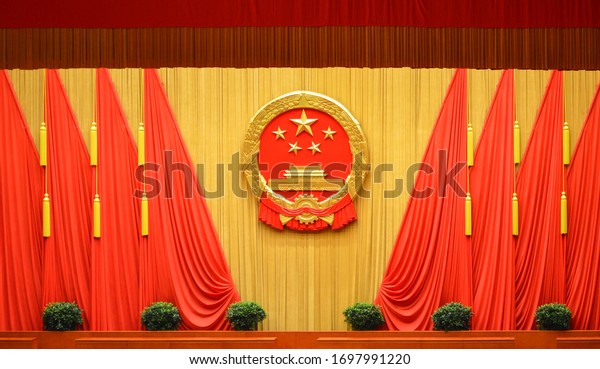 Beijing / China - March 13, 2014: The national\
emblem of the People\'s Republic of China at the Great Hall of the\
People in Beijing,\
China