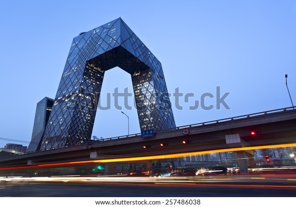 BEIJING, CHINA - MARCH 1st,\
2015: China Central Television (CCTV) Headquarters at dusk;  it\'s a\
234 m skyscraper. CCTV is the National TV station of\
China.