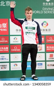 Beijing, China - MARCH 8, 2019: Bronze Medallist Jack Laugher Of Great Britain On Medals Podium Of Men’s 3m Springboard Final During Day Two Of The FINA/CNSG Diving World Series 2019 Beijing Station.