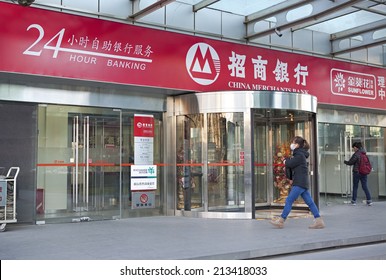 BEIJING, CHINA - NOVEMBER 30, 2013: People Is Seen At A China Merchants Bank Branch. China Merchants Bank Has A Total Net Capital Of 140 Billion Yuan And A Total Asset Of 2.6 Trillion Yuan