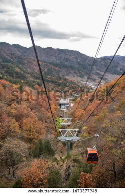 Beijing, China: October 25, 2018:\
Cable car at the Mutianyu side of the Great Wall of China. The\
Mutianyu Great Wall is about 43 miles north of Beijing,\
China