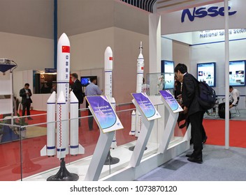 BEIJING, CHINA- SEPTEMBER 24, 2013: Unidentified People Look At Chinese Launch Vehicles Models On Display At The 64th International Astronautical Congress (IAC 2013). 