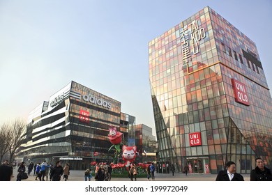 BEIJING, CHINA-JAN.22, 2014: People enjoy themselves around Sanlitun Village, shopping area. This is a famous and modern shopping area that attracts many locals and tourist.