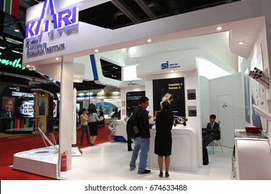 BEIJING, CHINA-SEP. 25, 2013: Unidentified People At The Korea Aerospace Research Institute (KARI) Booth During The 64th International Astronautical Congress (IAC 2013)