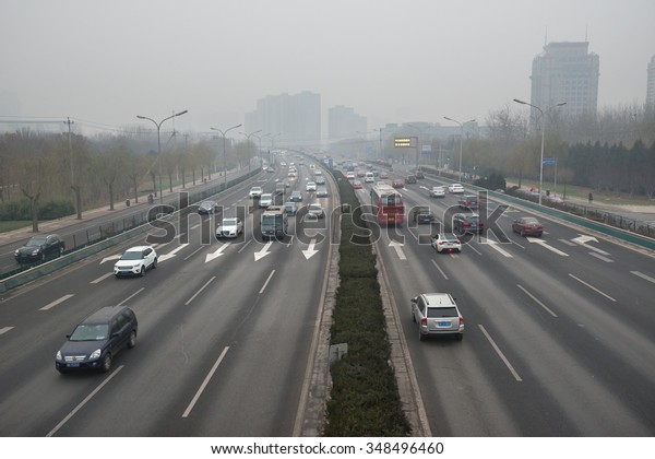 BEIJING - DEC 8: severe air pollution in Beijing\
city center on December 8, 2015 in Beijing, China. The Chinese\
government issued the historical first Red Alert on air pollution\
on this day.