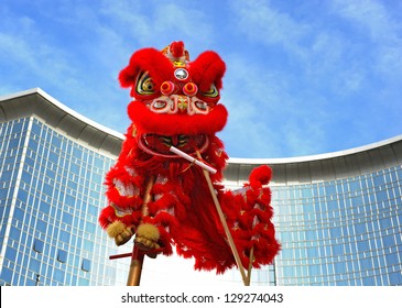 BEIJING - FEB 11: participants perform the dragon and lion dance during Chinese Spring Festival (Chinese New Year) on February 11, 2013 in Beijing, China. The dance is meant to evict evil spirits.