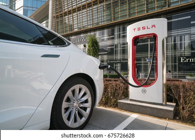 Beijing - June 7, 2017: Tesla Model S at a charging station near Chang'an Jie Street.