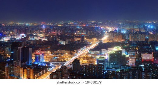Beijing at night aerial view with urban buildings.